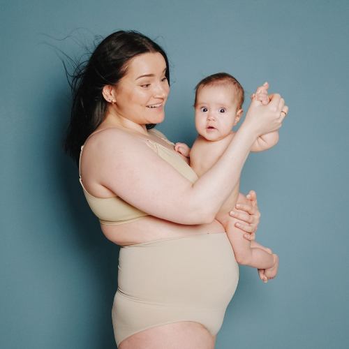 Postpartum woman performing Pilates for Diastasis Recti repair at MomBod PT